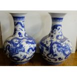 Pair of Large Blue and White Bulbous Vases with bottle necks, decorated with continuous dragon
