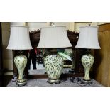 Matching Pair of yellow and black cameo glass table lamps (electric) and a similar oval shaped table