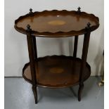 Oval Mahogany Two Tier Occasional Table with an inlaid top and stretcher shelf, 24”w