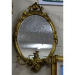 19thC Giltwood Wall Mirror with 3 carved sconces, in an ornate carved frame, 36”h