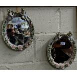 Pair of Dresden Wall Mirrors, oval shaped, profusely decorated with applied pink roses and each
