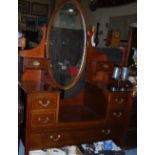 Edwardian Inlaid Mahogany Dressing Table with an oval mirror and gallery drawers, tapered legs, 46”