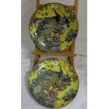 Matching pair of yellow Chinese circular plates impressed with pattern of 2 peacocks, 13"