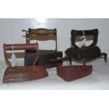 3 antique clothes irons, a spare iron & a trivet (5)