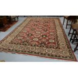 Wool Floor Rug, red ground with multiple patterns, 7ft w x 10ft l