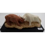 JUSTIN LAFFAN, coloured plaster sculpture of two fighting bulls (No. 3), signed at the back, on a