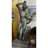Tall Bronze Figure of an early Roman Man/God, nude and standing by a plinth with rams head, on a
