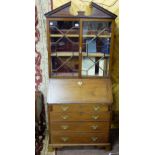 19thC Mahogany Bureau Bookcase, the arched pediment over two glazed doors enclosing shelves and a