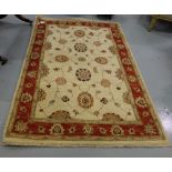 Zeigler Wool Floor Rug (Pakistan), beige ground with red multiple patterns, 1.9 x 1.27m