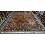 Persian Wool Floor Rug (of Indian origin), deep red ground with continuous patterns of vases and