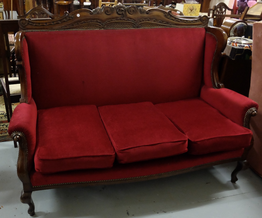 Mahogany framed 3 seater settee with carved top rail and sabre front legs, 56"w x 45"h x 28"d