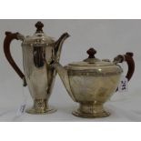 Irish Silver Tea Pot and Matching Coffee Pot, with turned handles, dated 1969, stamped “Irish Silver