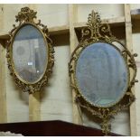 Two ornate Gilt Wall Mirrors with pediments, oval shaped mirrors, 1 with bevelled glass)