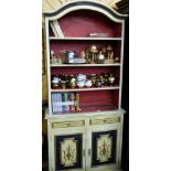 French open bookcase, shaped top over 4 shelves, 2 drawers and 2 cabinet doors, cream ground with