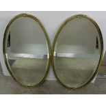 Matching pair of oval brass framed and brass beaded mirrors with bevelled mirror, 30” diameter (2)