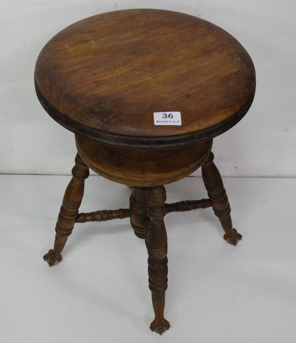 Revolving Oak Circular Stool, on 4 turned legs, bird claw toes, 14” dia