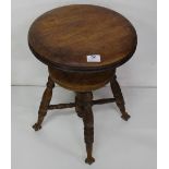 Revolving Oak Circular Stool, on 4 turned legs, bird claw toes, 14” dia