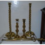 Pair of tall barley twist design brass candlesticks, another pair of candlesticks, two fire