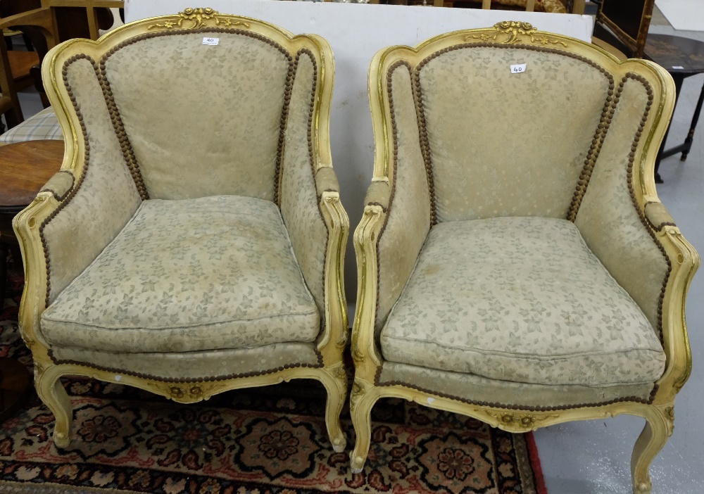 Matching Pair of French Cream Painted Armchairs, with worn green silk covered backs and cushions