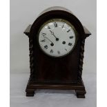 Chiming Mantle Clock in Mahogany Case, with white dial, roped side columns, flame mahogany front,