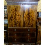 19thC Gents Mahogany Wardrobe, a moulded top over two oval feather mahogany panelled doors enclosing