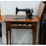 Singer Hand Sewing Machine in Walnut framed Stand with folding top