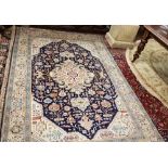 Afghan Wool Floor Rug, cream ground with central navy ground diamond pattern, multiple borders, 1.