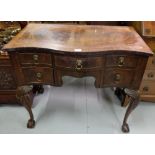 Mahogany Side Table, serpentine shaped, with 5 apron drawers, on ball and claw feet, 31”h x 35”w