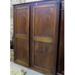 19thC Mahogany Wardrobe, the two panelled doors enclosing hanging robes, on a platform base, 66”w