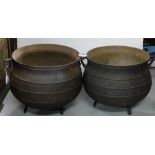 Similar Pair of Cast Iron Skillet Pots, each raised on 3 feet, 14.5”dia x 13”h, painted black