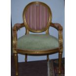 Carved Gilt Wood Armchair, covered with contemporary stripes and green padded seat, turned legs