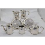 5 hotel tea, coffee & water pots, a jug & pair of glass based wine bottle stands (7)