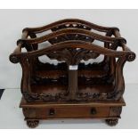 Mahogany Canterbury with fretwork dividers and a stretcher drawer, bun feet, 21”w