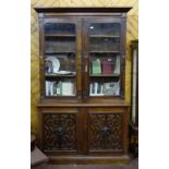 Late 19thC Oak Bookcase, the two glazed upper doors enclosing shelves over a base with two cabinet