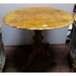 Victorian Walnut Occasional Table with a shaped top over a central pod, 4 splayed legs, 32”w