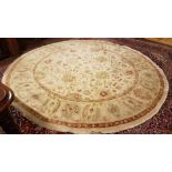 Circular Afghan Ziegler Wool Floor Rug, cream ground with all over continuous pattern of green and