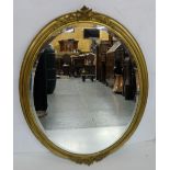 Edwardian Gilt Framed Overmantle, with applied mounts, oval bevelled mirror, 32”h