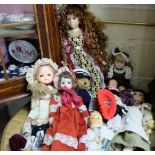 Collection of 11 ornamental dolls, some porcelain in various sizes and outfits, country girl,