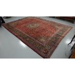 Old red ground Persian Kashan carpet, traditional all-over design, 3.9x 2.95m