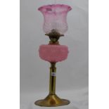 Victorian Oil Lamp, brass base with tulip shaped red glass shade and a pink glass bowl