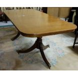 Mahogany Regency style dining table, with one removable leaf on twin pod base, 85”L x 39”W