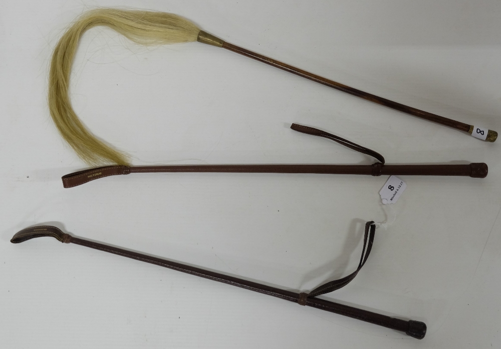 Two leather bound hunting crops & a fly swatch with turned mahogany handle (3)