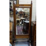 Regency Mahogany Cheval Mirror, with a swinging insert, inlaid side pillars, brass toes and castors,