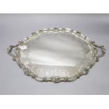 Antique sterling silver twin handled tray. By Thomas Bradbury. With foliate borders and cast scallop