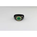 Elegant ladies emerald ring. Cabochon set in black onyx shank approx size M 10mm x 6mm