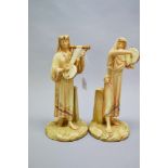 Pair of Royal Worcester blush ivory Egyptian musicians (2)