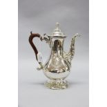 George III baluster form coffee, hinged dome lid & flame finial. In sterling silver marked IK,