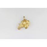 A stunning 18ct matte gold elephants head pendant, decorated with diamond & ruby highlights and