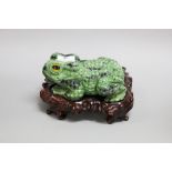 Carved green Jade Toad on wooden base, approx 12cm H x 20cm W