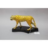 Chinese enamel figure of a cheetah on stand, approx 14cm H including x 21cm W